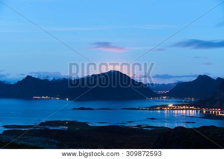 Lofoten Landscape During Night With The Rising Moon Near Fredvang.