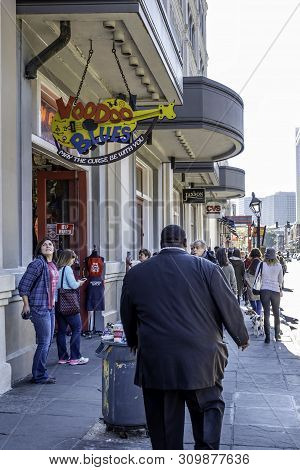 New Orleans, Usa - Dec 11, 2017: A Crowd Of People Walking On A Sidewalk Along Decatur Street, At Th