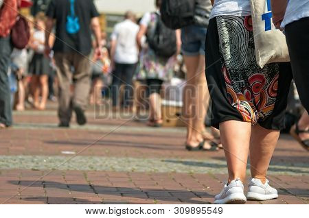 People At A Weekend Flea Market On The Streets With Blurred Background