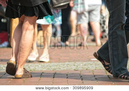People At A Weekend Flea Market On The Streets With Blurred Background