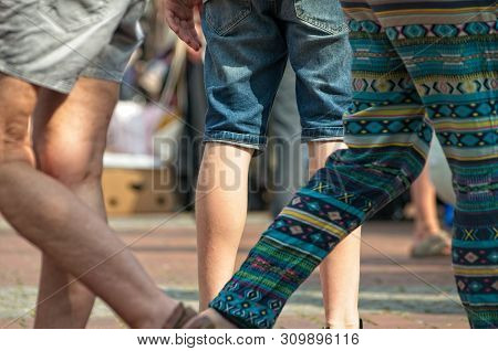 People At A Weekend Flea Market On The Streets With Blurred Background