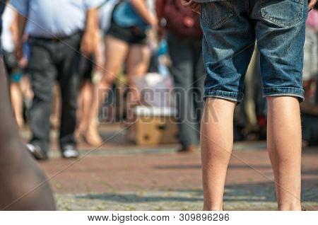 People At A Weekend Flea Market On The Streets With Blurred Background
