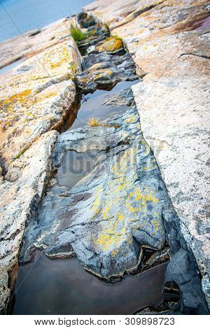 Black Intrusive Igneous Basalt Dike Rock And Granite At Schoodic Point In Acadia National Park, Main