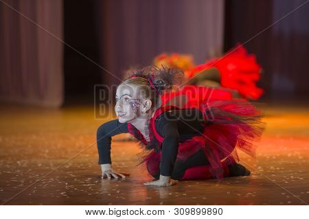 A Little Girl Performs A Dance Number.little Girl Dancing