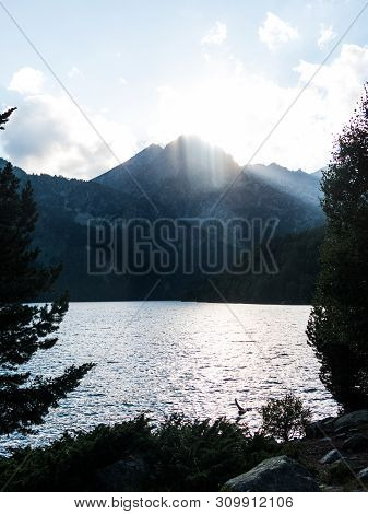 The Last Rays Of Sun On The Pond Of Sant Maurici, In The Aiguestortes And Sant Maurici National Park