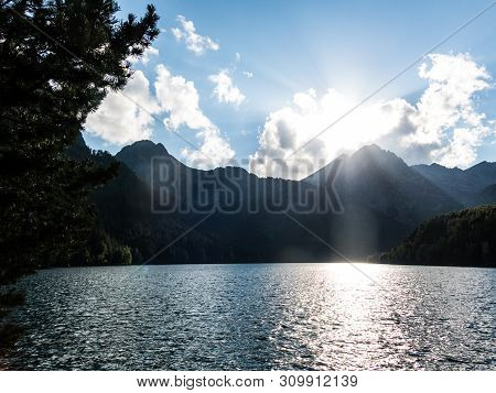 The Last Rays Of Sun On The Pond Of Sant Maurici, In The Aiguestortes And Sant Maurici National Park