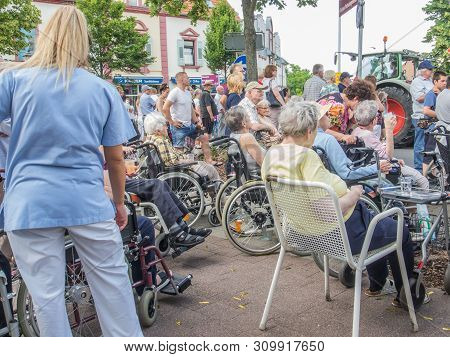 Kirchheimbolanden,rheinland-pfalz,germany-06 23 2019: Elderly People From Nursing Home Waiting For P