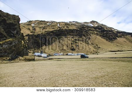 Old Stone House Destroyed Ancient Viking Overgrown With Yellow Dry Grass In Iceland