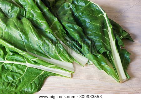 Balkan Cuisine. Blitva ( Chard Leaves ) - Popular Leafy Vegetables. White Rustic Background