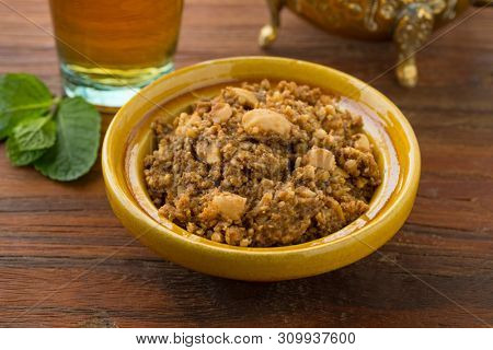 Traditional Moroccan homemade sellou and tea close up