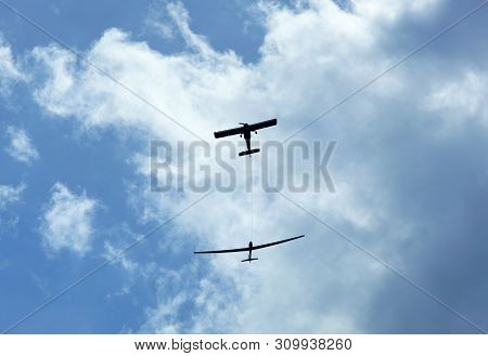 The Small Airplane Helping To Reach The Height Before Releasing The Sailplane Glider (birstonas, Lit