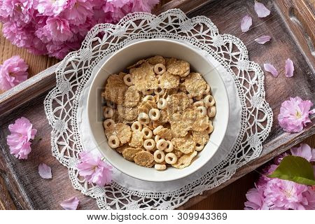 Breakfast Cereals With Pink Kwanzan Cherry Blossoms, Top View
