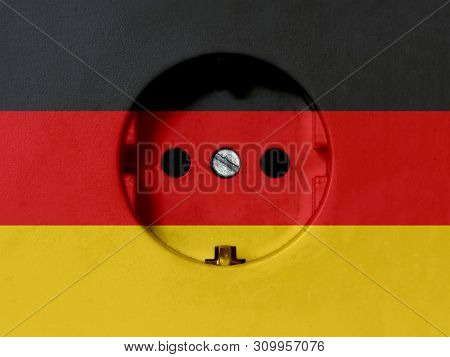 Electricity Concept: Dirty Type F Power Socket With Germany Flag