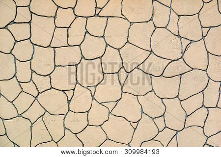 The Plastered Wall With An Abstract Mesh Mosaic Pattern Of Monotonous Cream Color For The Textured B