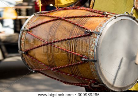 Dhol Drummer Playing This Traditional Indian Instrument In The Street
