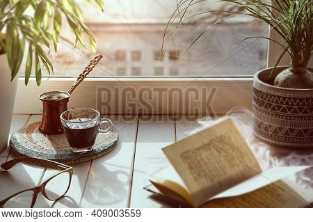 Oriental Coffee In Traditional Turkish Copper Coffee Pot With Flowers On Window Sill. Rustic Wooden 