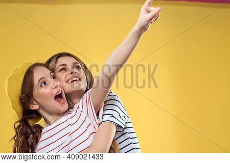 Mom And Daughter Embrace Joy Fun Childhood Lifestyle Yellow Background