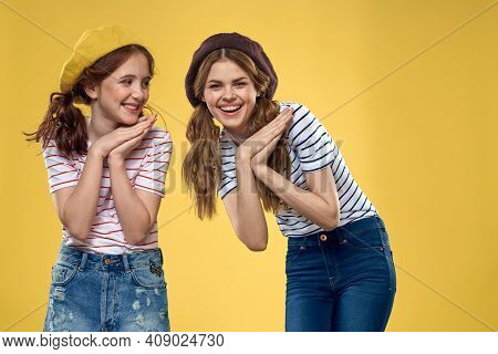 Funny Mom And Daughter Wearing Hats Fashion Fun Joy Family Yellow Background
