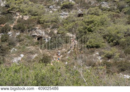 Vis, Croatia - Aug 17, 2020: Tourists Hike Down To Sheltered Stiniva Beach In Summer