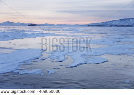 Lake Baikal, Winter. Cape Uyuga Sunset Landscape. Small Sea