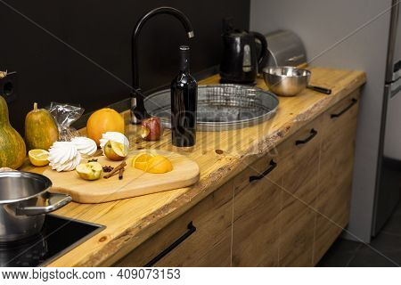 Oak Kitchen Worktop On Kitchen With A Sink, Cookstove And Food Ingredients, Bottle And Kitchen Facil