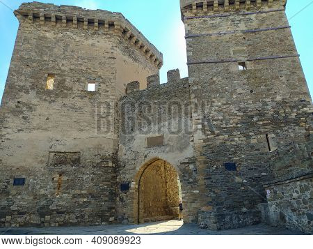 The Gate Of The Old Medieval Fortress In The Crimea In The City Of Sudak. Travel Concept. Mobile Pho