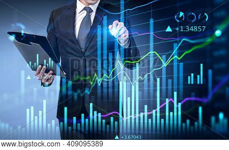 Businessman Using His Planner Checking The Agenda Of Upcoming Meetings About Stock Market Business. 