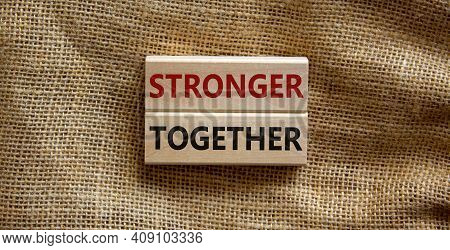 Stronger Together Symbol. Concept Words 'stronger Together' On Wooden Blocks On A Beautiful Canvas B