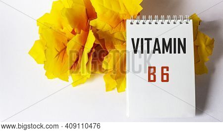 The Word Vitamin B6 Is Written On A Notebook On A White Background