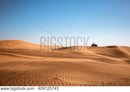 Desert Sandy Minimalistic Landscape With One Black Buggy Quad Bike Far And Wheels Traces, Safari Tou