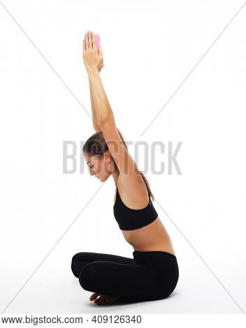 Yoga, sport and fitness concept:Woman practicing yoga with yoga block over white background