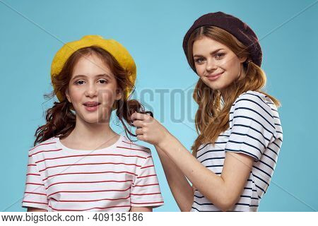 Fashion Sisters In Hats Fun Lifestyle Blue Background Studio