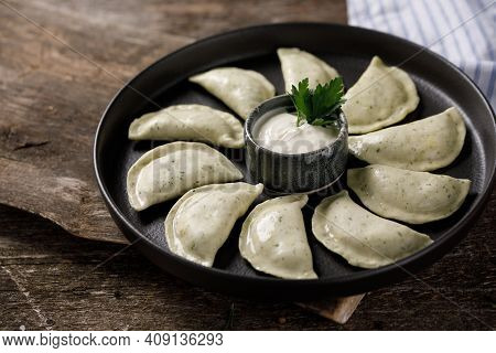 Appetizing Traditional Russian Dumplings Made By Hand With Delicious Curd Filling. Still Life On A W