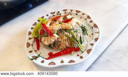 Stir-fried Rice Vermicelli With Water Mimosa And Prawns In White Dish Or Plate At Chinese Restaurant