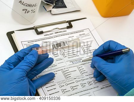 Nurse Analyses Positive Pcr Tests Of Covid-19 In A Hospital Laboratory, Conceptual Image