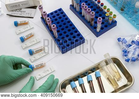 Nurse Analyses Positive Pcr Tests Of Covid-19 In A Hospital Laboratory, Conceptual Image