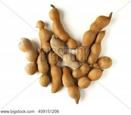 Tamarind Tree Produces Brown, Pod-like Fruits That Contain A Sweet, Tangy Pulp