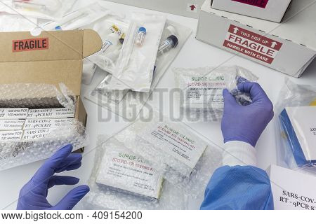Nurse Opening Novel Coronavirus 2019 Ncov Pcr Diagnostics Kit. This Is Rt-pcr Kit To Detect Presence