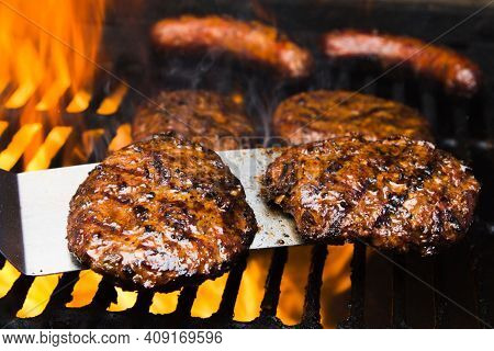 Elicious Burger With Sauce. Hamburger. Delicious Grilled Angus Burger With Cheese, Salad And Tomatoe