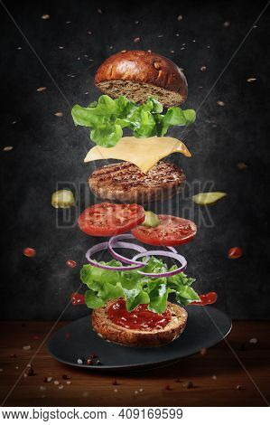 Elicious Burger With Sauce. Hamburger. Delicious Grilled Angus Burger With Cheese, Salad And Tomatoe