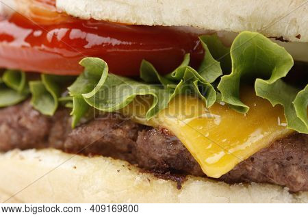 Elicious Burger With Sauce. Hamburger. Delicious Grilled Angus Burger With Cheese, Salad And Tomatoe