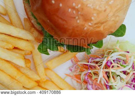 Elicious Burger With Sauce. Hamburger. Delicious Grilled Angus Burger With Cheese, Salad And Tomatoe