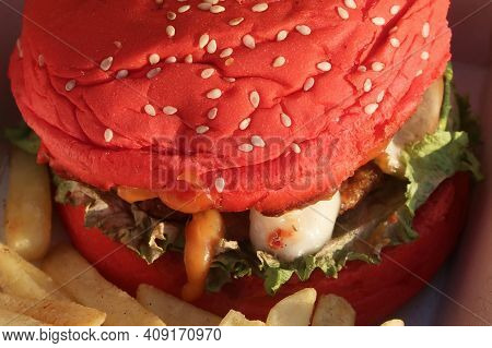 Elicious Burger With Sauce. Hamburger. Delicious Grilled Angus Burger With Cheese, Salad And Tomatoe