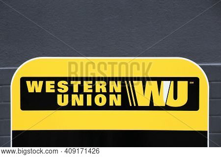 Tarare, France- June 27, 2020: Western Union Sign And Point. The Western Union Company Is An America