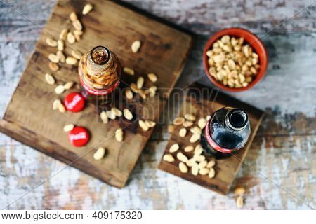 Coca Cola Bottles With Peanuts. Traditional American Snack.