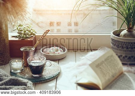 Oriental Coffee Cooked In Traditional Turkish Copper Coffee Pot With Flowers On Windowsill. Ruscic W
