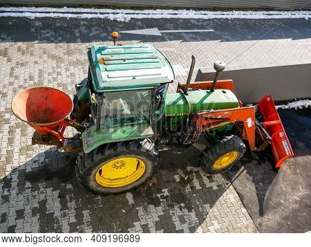 Miercurea Ciuc, Romania- 21 February 2021: John Deere Tractor Used For Cleaning The Snow At Local Ma
