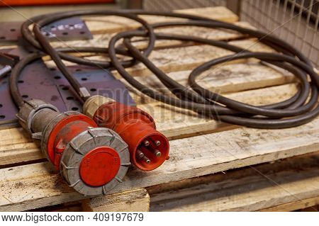 Three-phase Plug And Socket On A Wooden Pallet