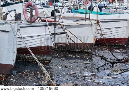 Environmental Pollution - Extremely Dirty Water Between Moored Ships In The Harbor