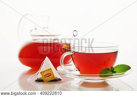 Mogilev, Belarus - December 15 2020: Lipton Yellow Label Tea Bag In Brown Glass Cup And Teapot On Is